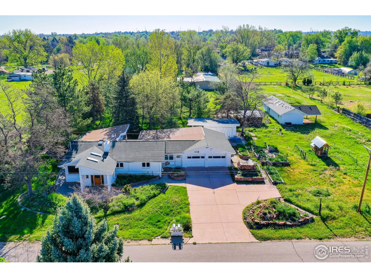 1112 Gapter Road Boulder, CO 80303 - Photo 1 of 40 an aerial view of a house with a garden
