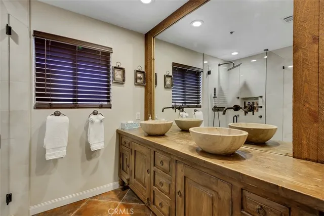 a kitchen with sink and refrigerator