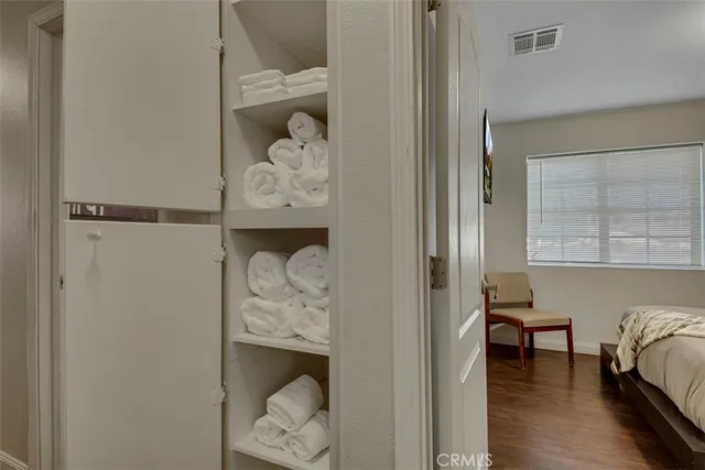 a view of bedroom with wooden floor