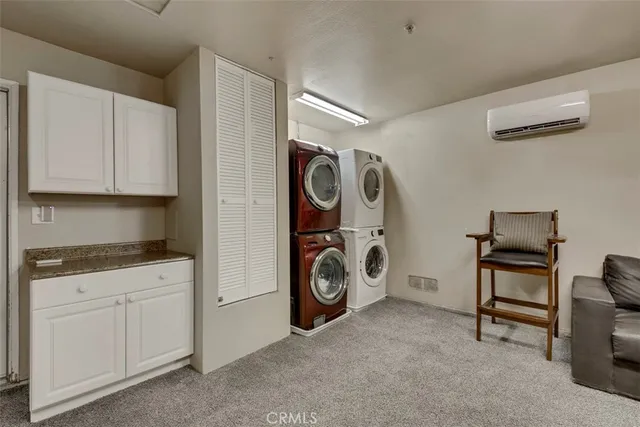 a utility room with sink dryer and washer