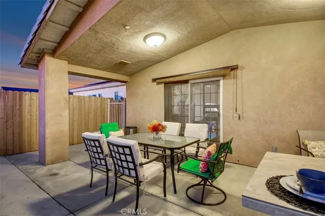 a kitchen with a table chairs stove and cabinets