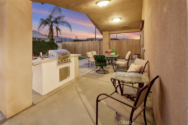 a view of a patio with swimming pool
