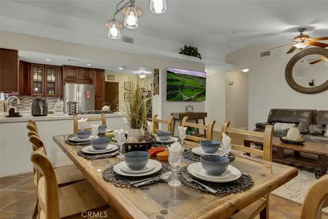a kitchen with a dining table and chairs