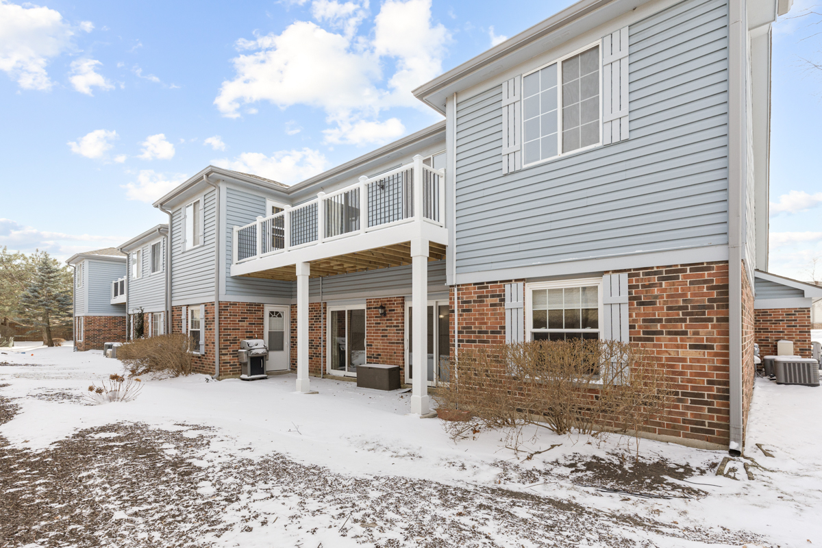 1505 Commodore Court, Unit 1 Schaumburg, IL 60193 - Photo 23 of 29 a view of a house with a yard and sitting area