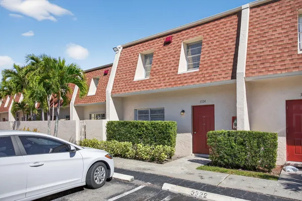 a view of a car parked in front of a house