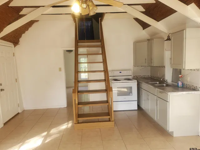 a view of a kitchen with a sink