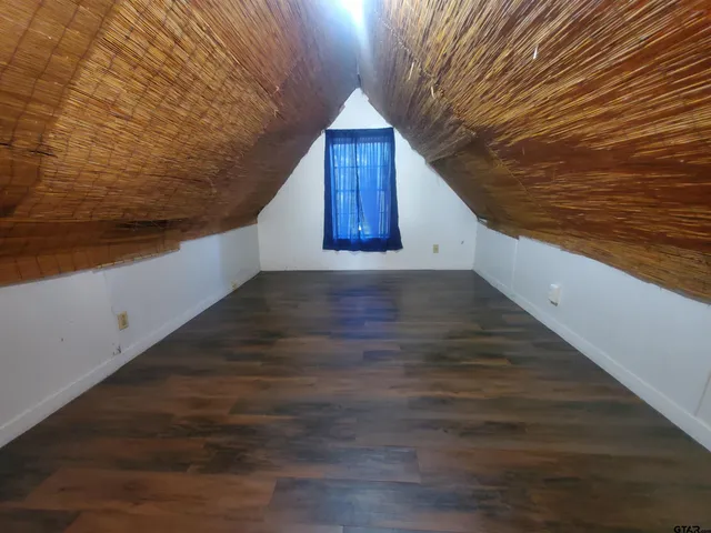 a view of front door of house with wooden floor