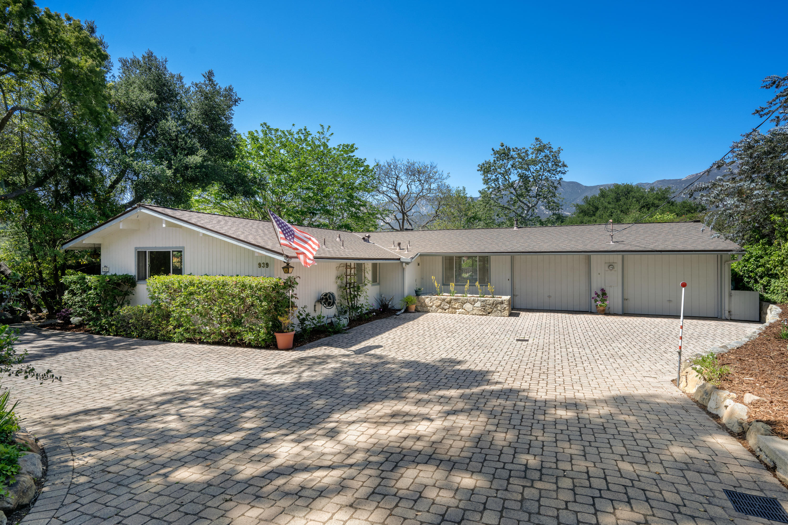 939 Mission Ridge Road Santa Barbara, CA 93103 - Photo 2 of 14 a front view of house with yard and trees in the background