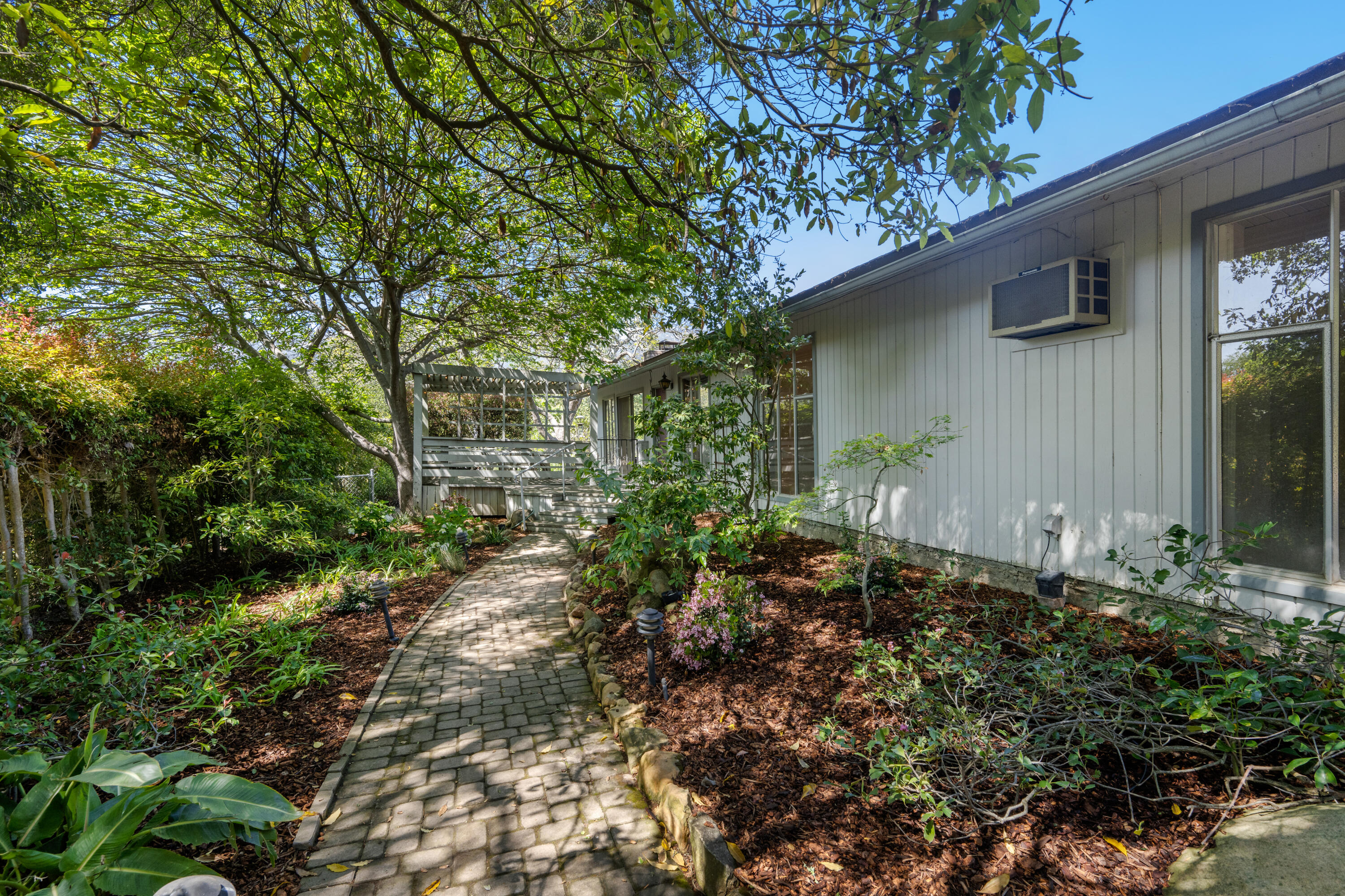 939 Mission Ridge Road Santa Barbara, CA 93103 - Photo 3 of 14 a backyard of a house with lots of green space