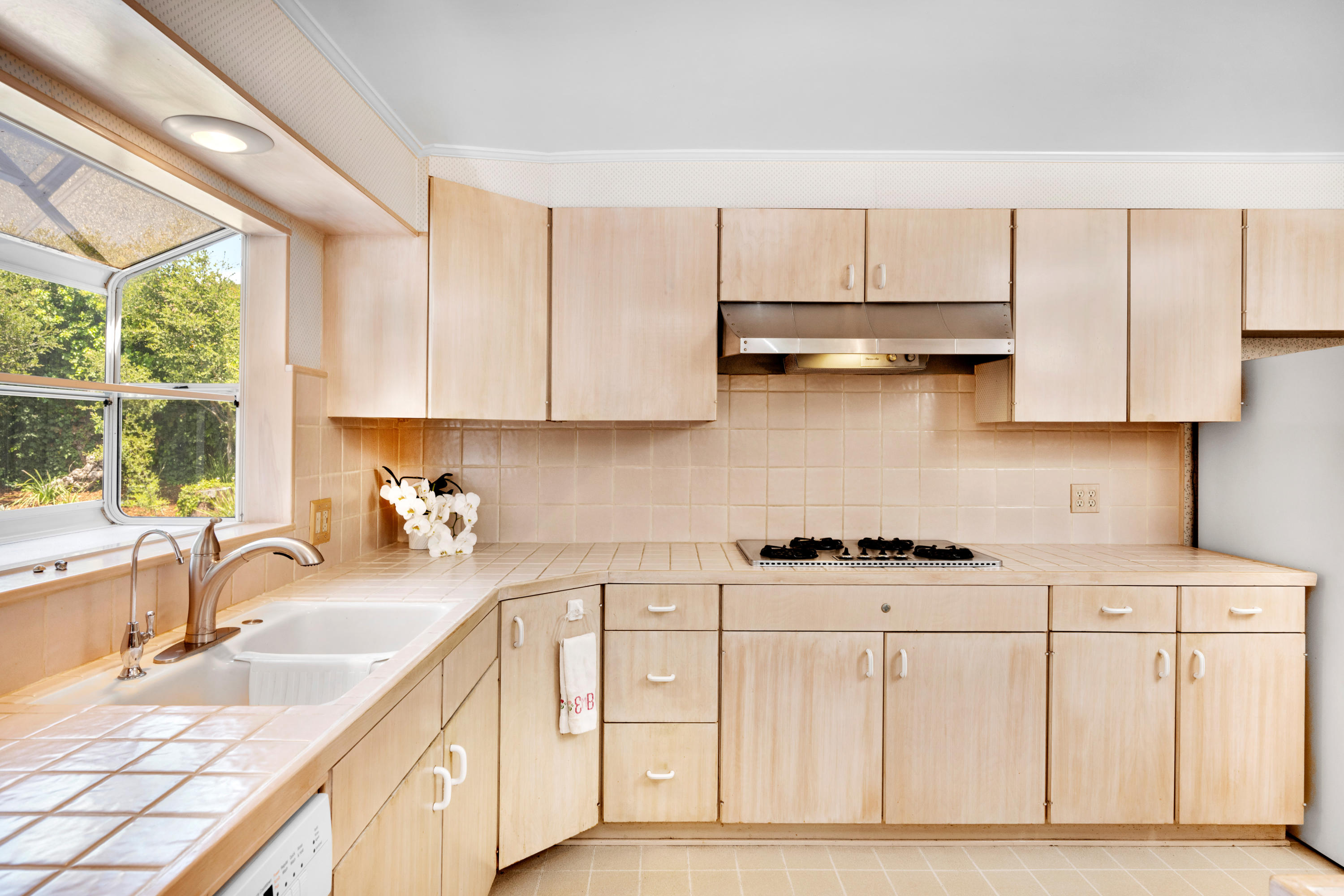 939 Mission Ridge Road Santa Barbara, CA 93103 - Photo 6 of 14 a kitchen with stainless steel appliances granite countertop a sink stove and cabinets