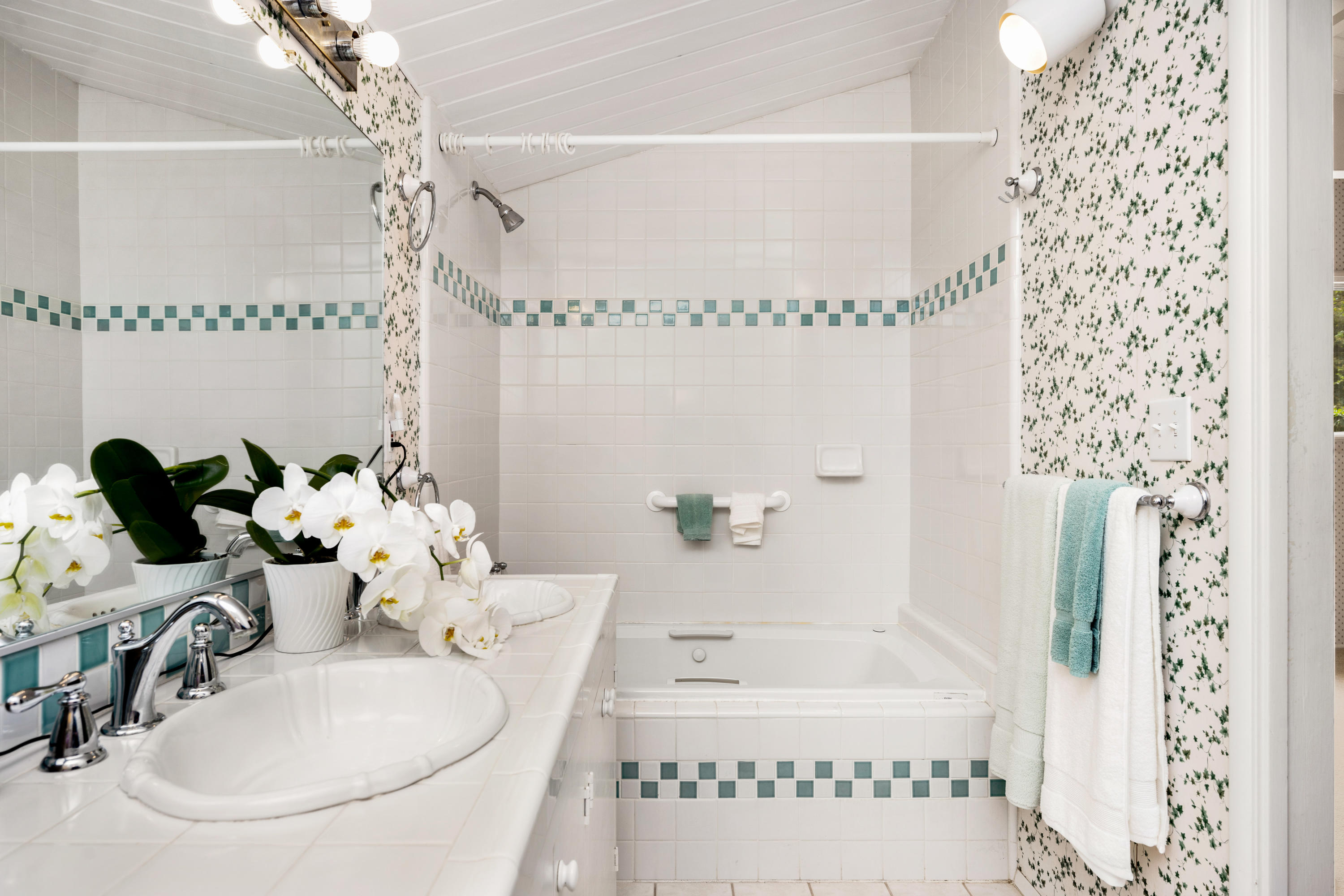 939 Mission Ridge Road Santa Barbara, CA 93103 - Photo 9 of 14 a bathroom with a tub sink and mirror