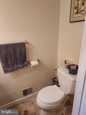 a white toilet sitting next to a toilet