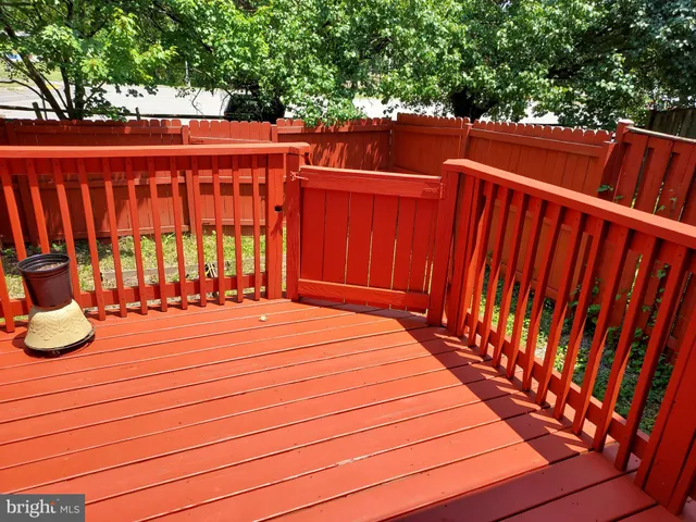 a balcony with wooden floor