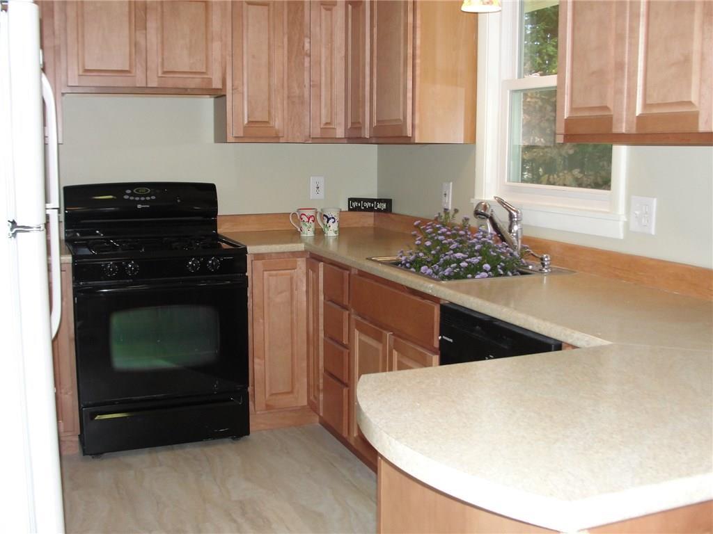 47 Pinhook Road Bridgton, ME 04009 - Photo 11 of 35 Vinyl tile floor is bright and new.