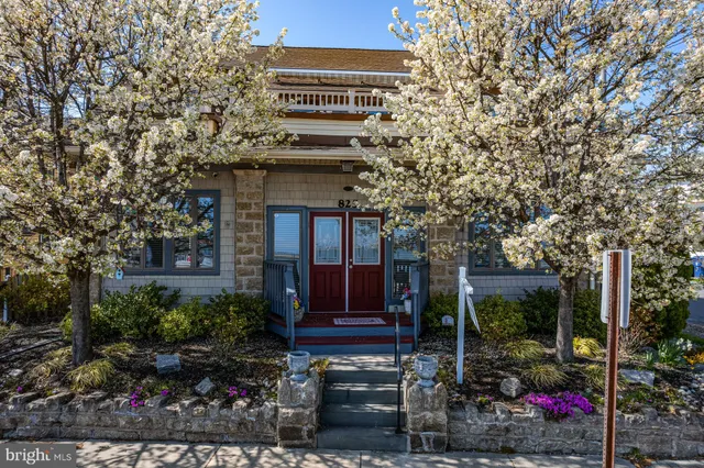 a view of a house with a tree