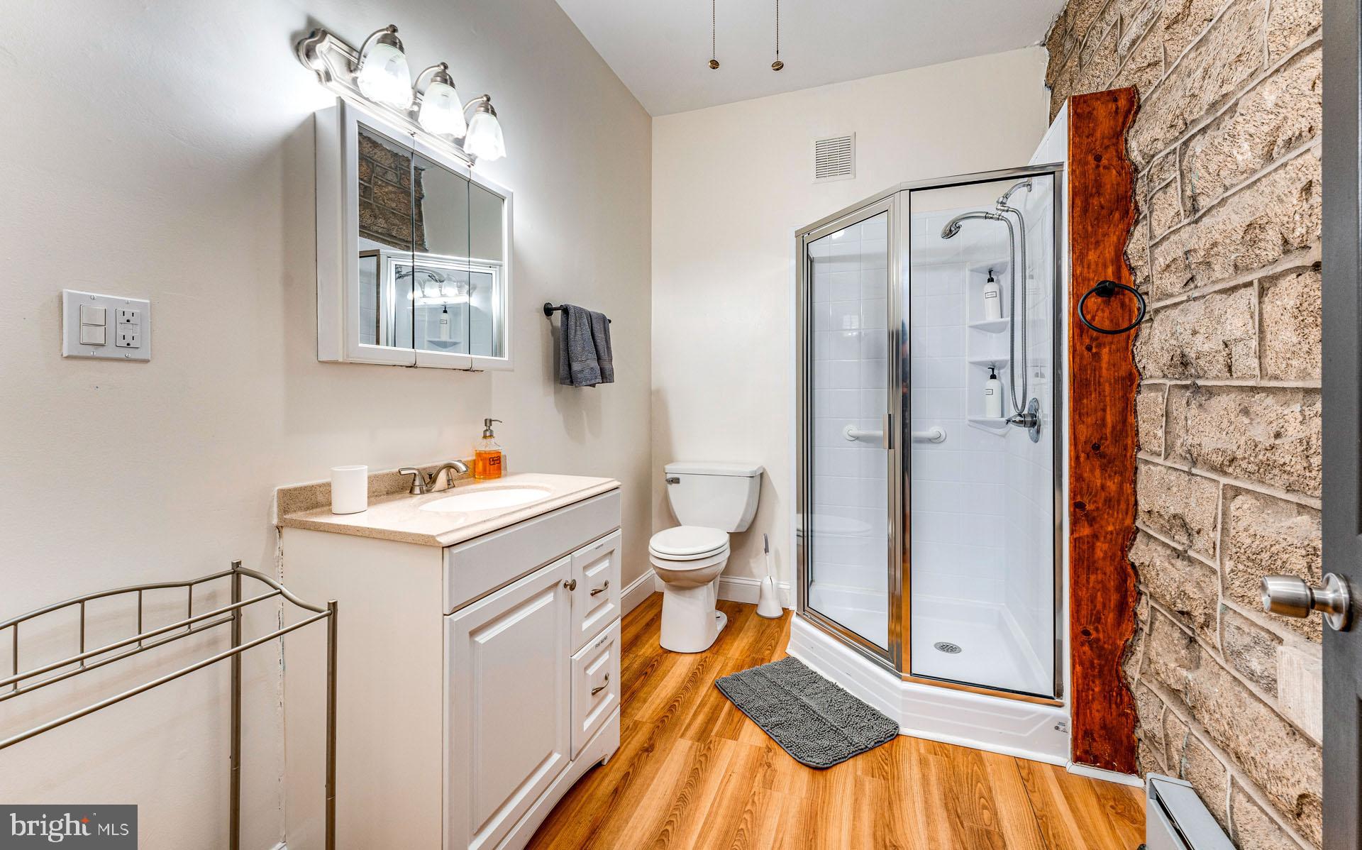 825 Bay Avenue Somers Point, NJ 08244 - Photo 13 of 37 a bathroom with a sink a toilet and shower