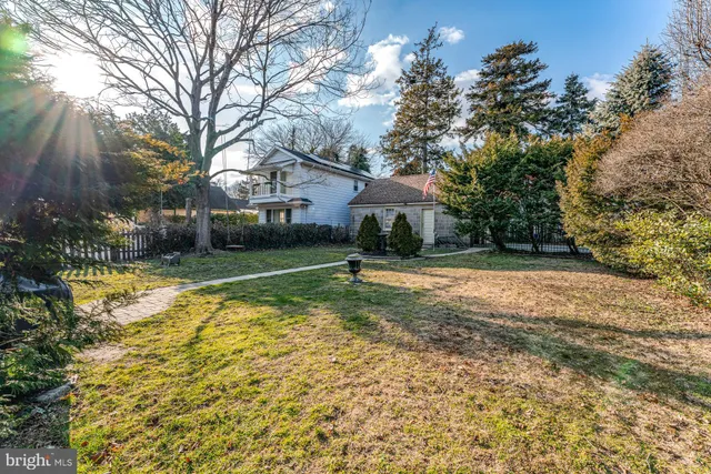 a view of swimming pool is middle in the garden