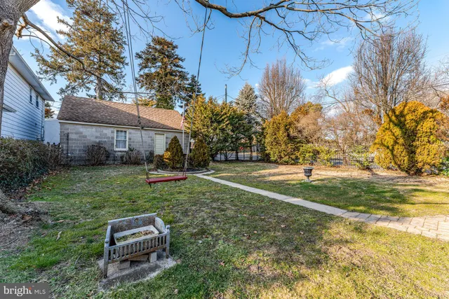 a view of backyard with large trees
