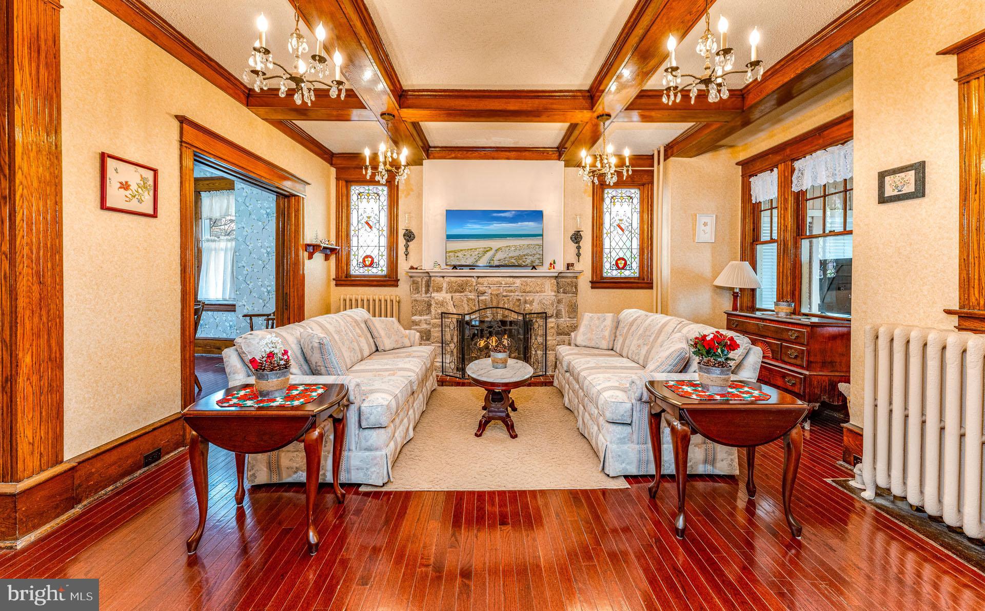 825 Bay Avenue Somers Point, NJ 08244 - Photo 5 of 37 a living room with fireplace furniture and a wooden floor