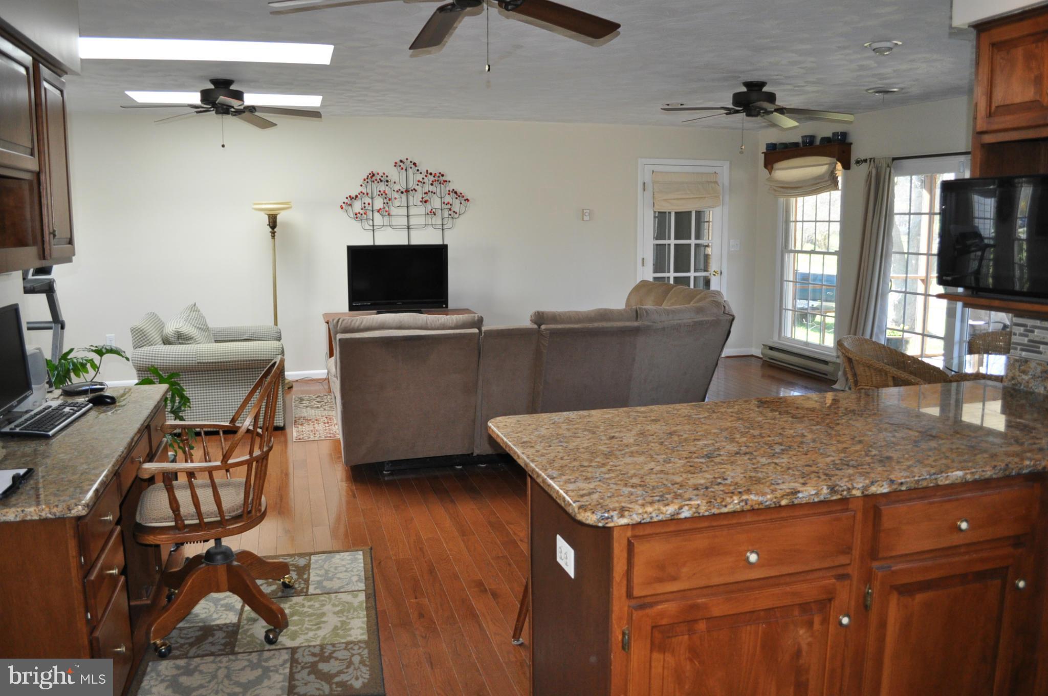 200 East Nicodemus Road Westminster, MD 21157 - Photo 19 of 27 Great room open to kitchen and screened porch