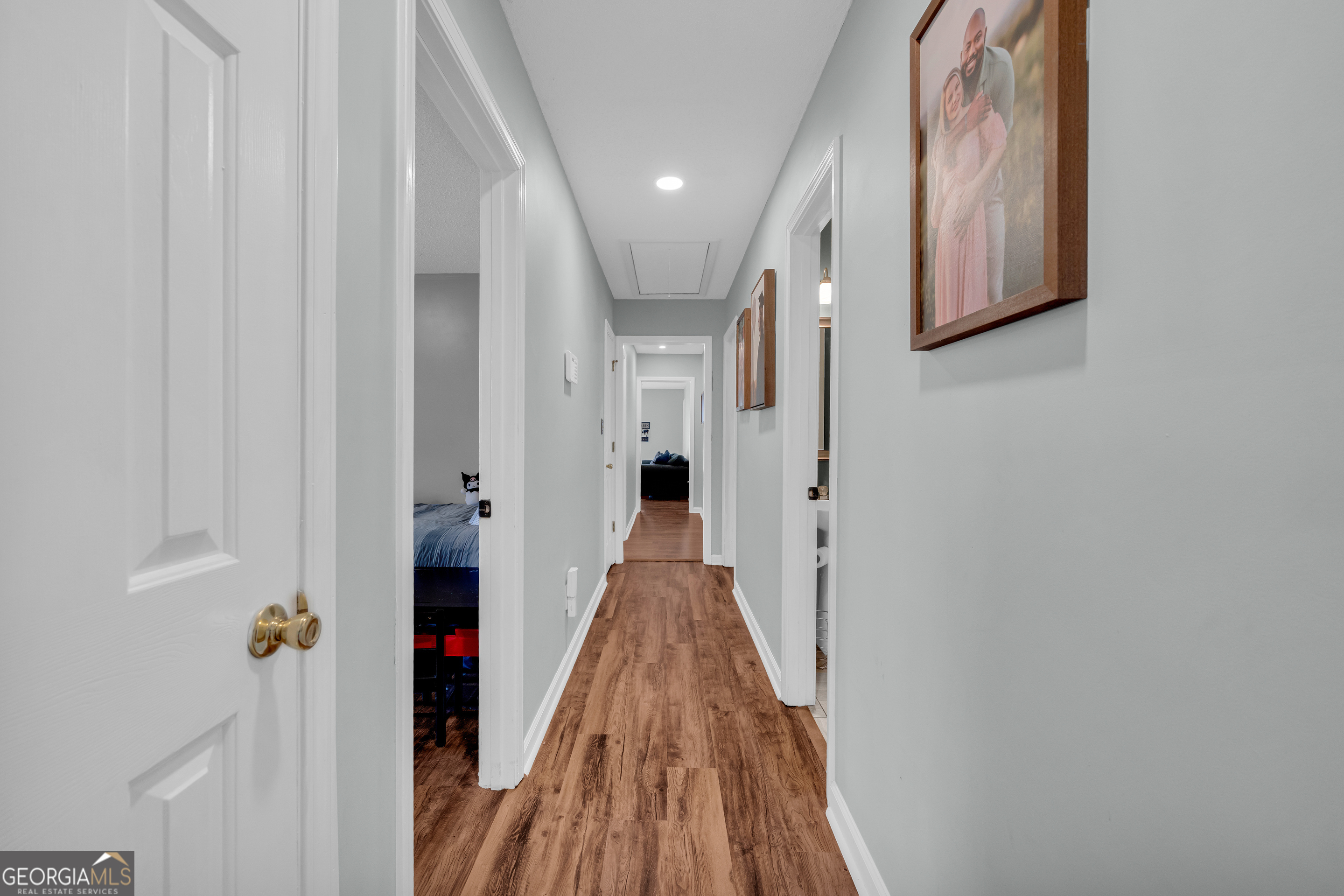 234 Old River Road Cornelia, GA 30531 - Photo 21 of 40 a view of a hallway with wooden floor and staircase