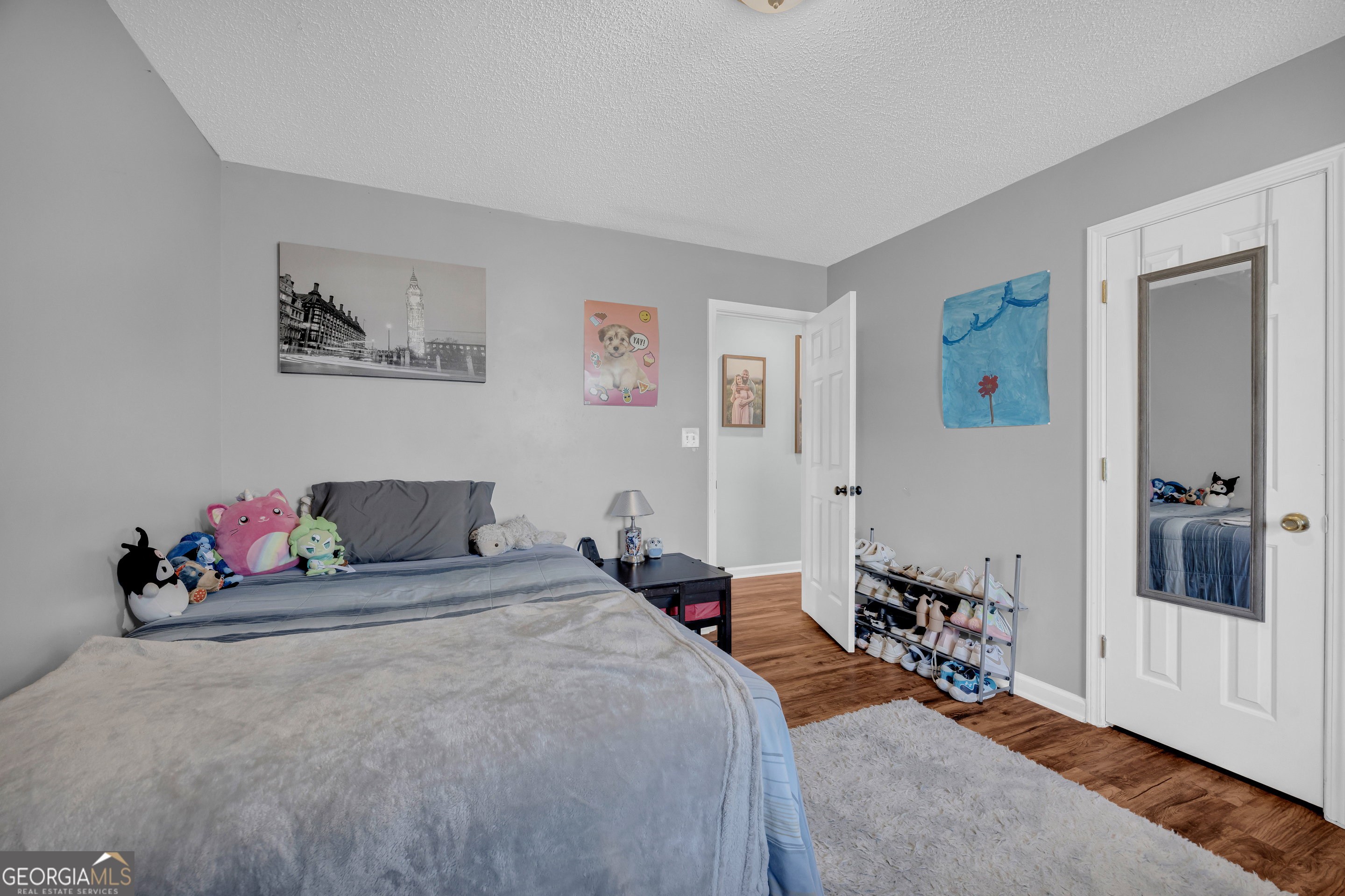 234 Old River Road Cornelia, GA 30531 - Photo 23 of 40 a bed room with a bed and a couch