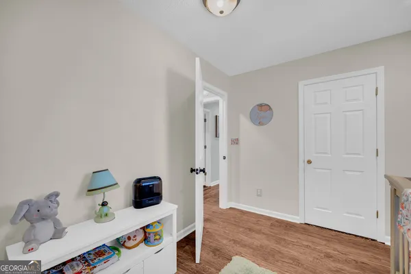 a bathroom with a sink mirror and toilet
