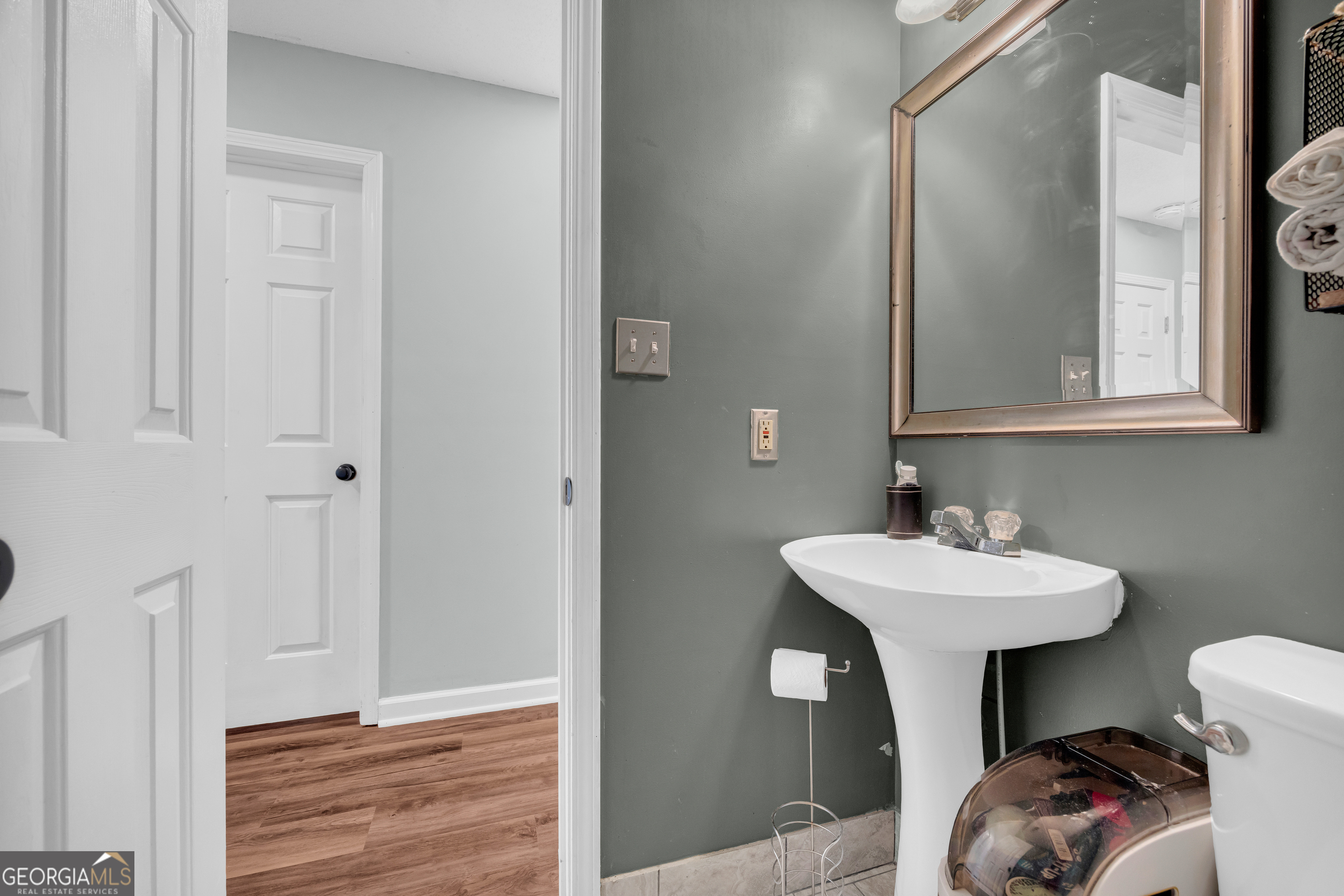 234 Old River Road Cornelia, GA 30531 - Photo 27 of 40 a bathroom with a sink mirror and toilet