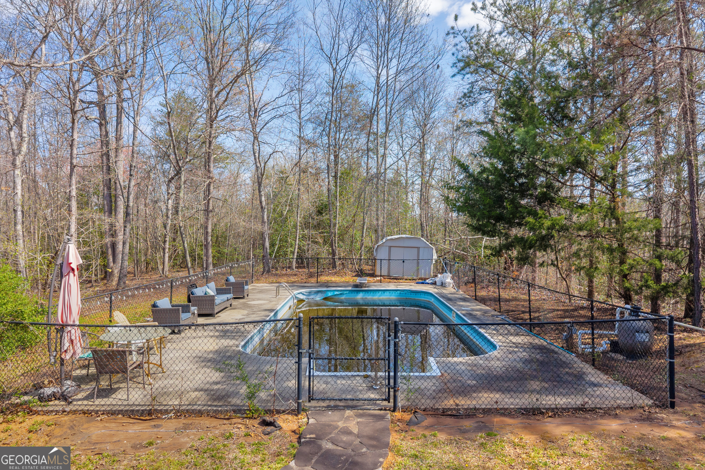 234 Old River Road Cornelia, GA 30531 - Photo 35 of 40 a view of a swimming pool with a patio