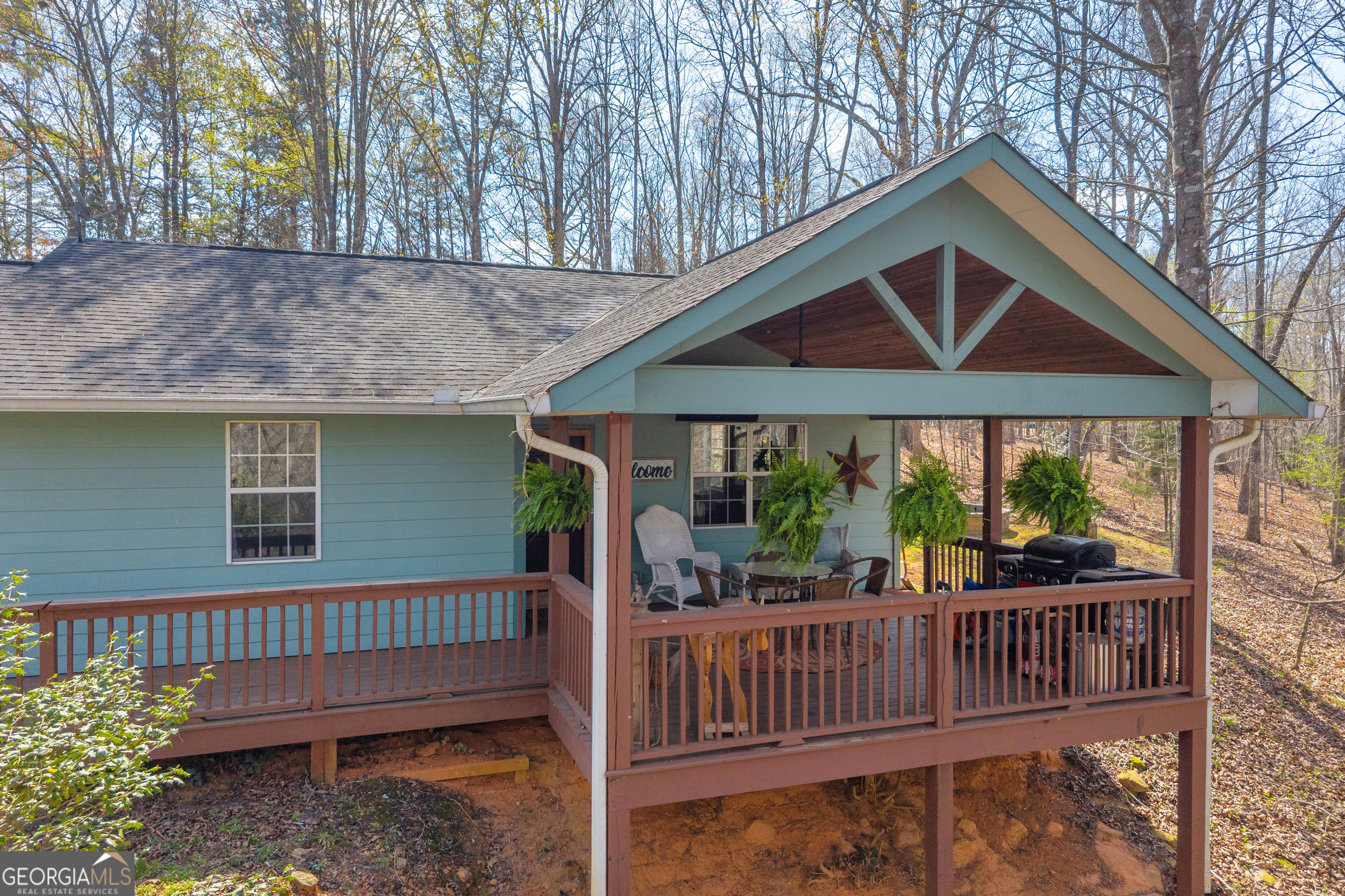 234 Old River Road Cornelia, GA 30531 - Photo 6 of 40 a view of house with a deck and a yard