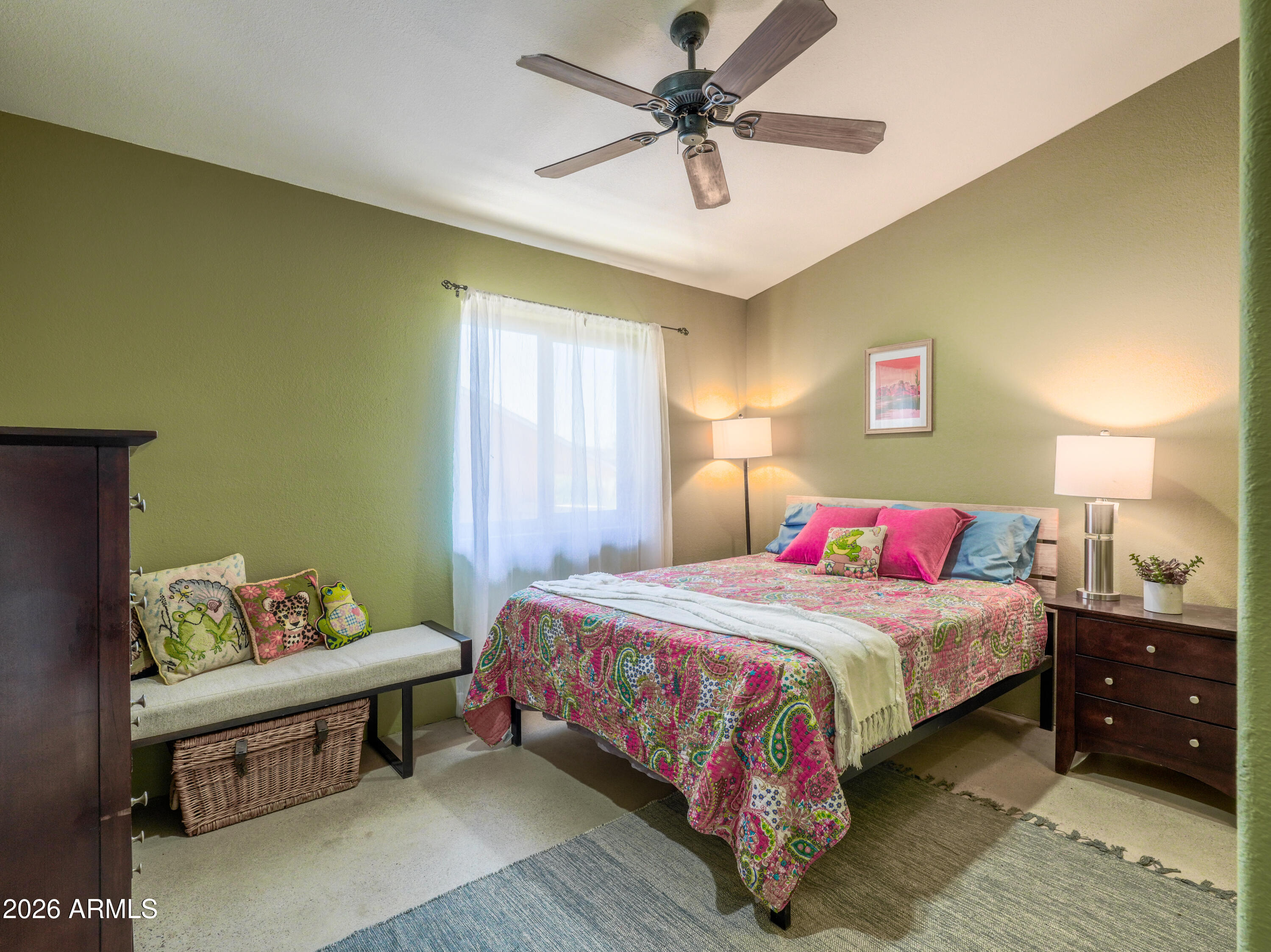 1224 North Acacia Road Apache Junction, AZ 85119 - Photo 28 of 48 a bedroom with a bed and a chandelier