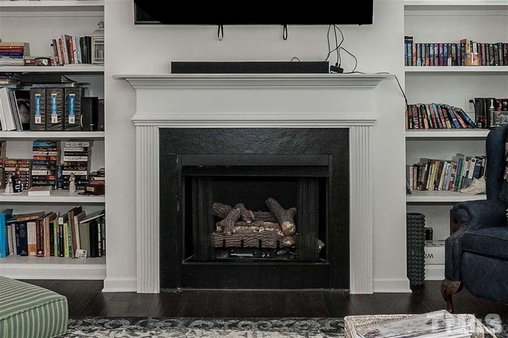 42 Griffith Place Clayton, NC 27520 - Photo 12 of 26 a living room with furniture and a fireplace
