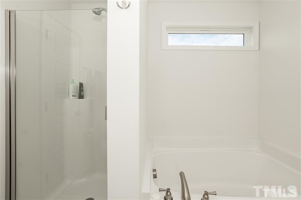 42 Griffith Place Clayton, NC 27520 - Photo 20 of 26 a bathroom with a shower