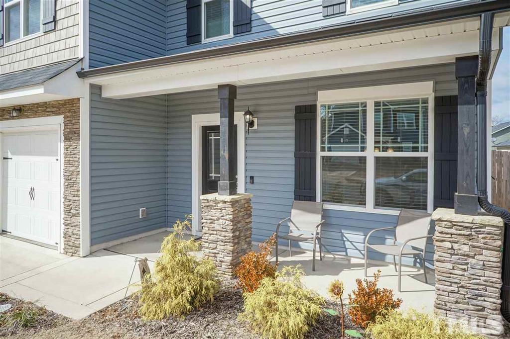 42 Griffith Place Clayton, NC 27520 - Photo 2 of 26 a front view of a house with a yard