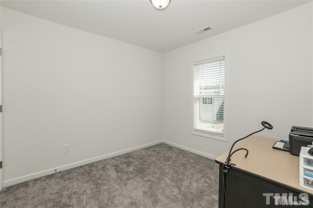 42 Griffith Place Clayton, NC 27520 - Photo 22 of 26 a view of a sink and dishwasher with wooden floor