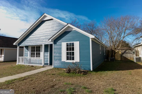 a front view of a house with a yard