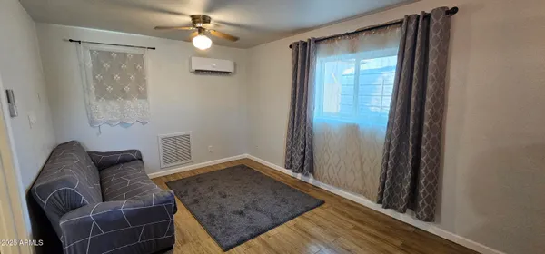 a living room with furniture and a window