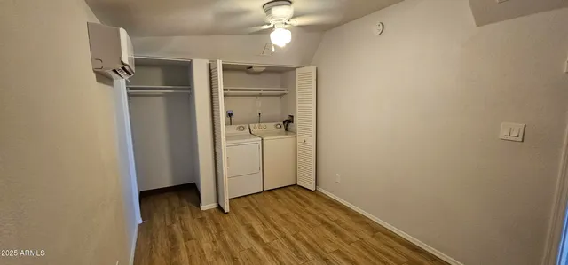 a view of a livingroom with wooden floor
