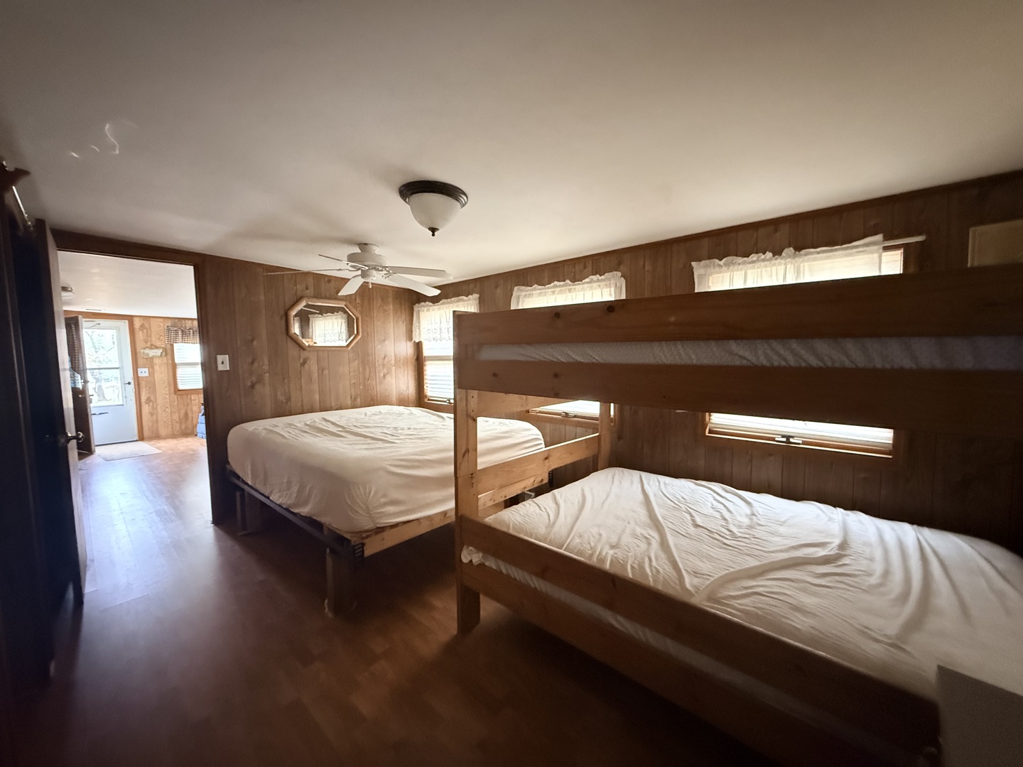 3-166 Woodhaven Lakes Sublette, IL 61367 - Photo 16 of 20 a bedroom with a bed and wooden floor