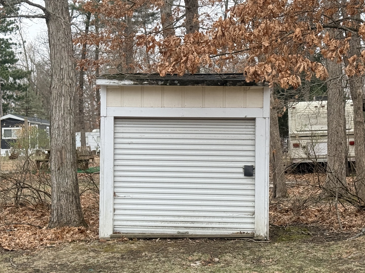 3-166 Woodhaven Lakes Sublette, IL 61367 - Photo 20 of 20 a view of a house with a door and a tree