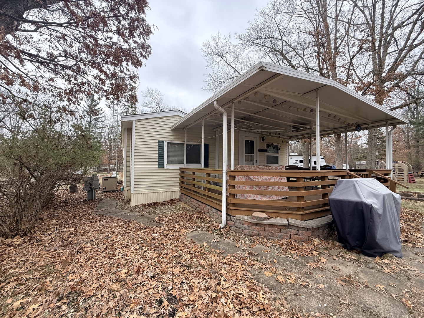 3-166 Woodhaven Lakes Sublette, IL 61367 - Photo 2 of 20 a view of a house with backyard and chairs