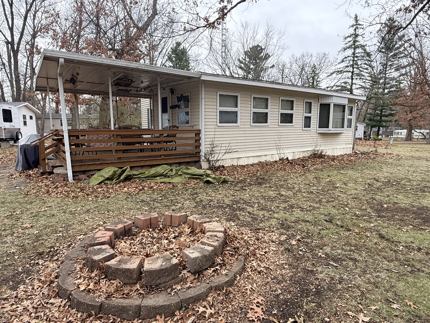 3-166 Woodhaven Lakes Sublette, IL 61367 - Photo 5 of 20 a backyard of a house with barbeque oven and table