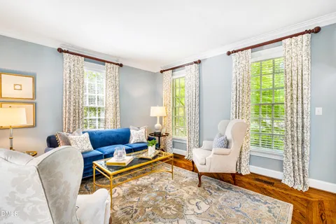a bathroom with a granite countertop sink and a window