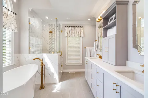 a spacious bathroom with a granite countertop sink and a large mirror