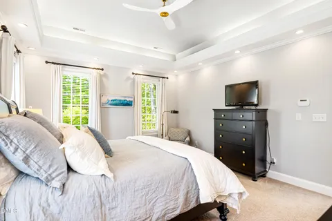 a bathroom with a sink double vanity granite tub shower and a mirror