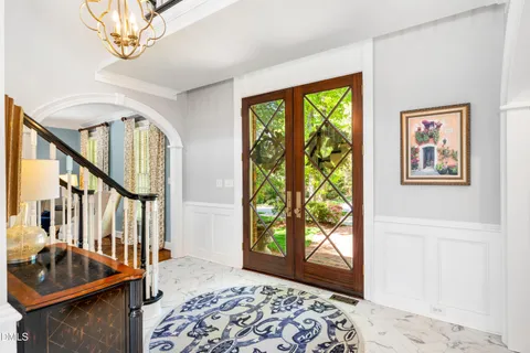 a view of entryway and hall with dining room