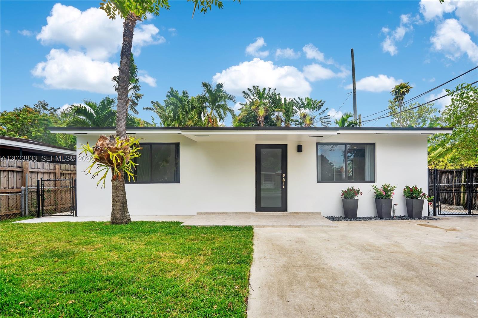 6566 Southwest 35th Street Miami, FL 33155 - Photo 3 of 36 a view of a house with backyard and a garden