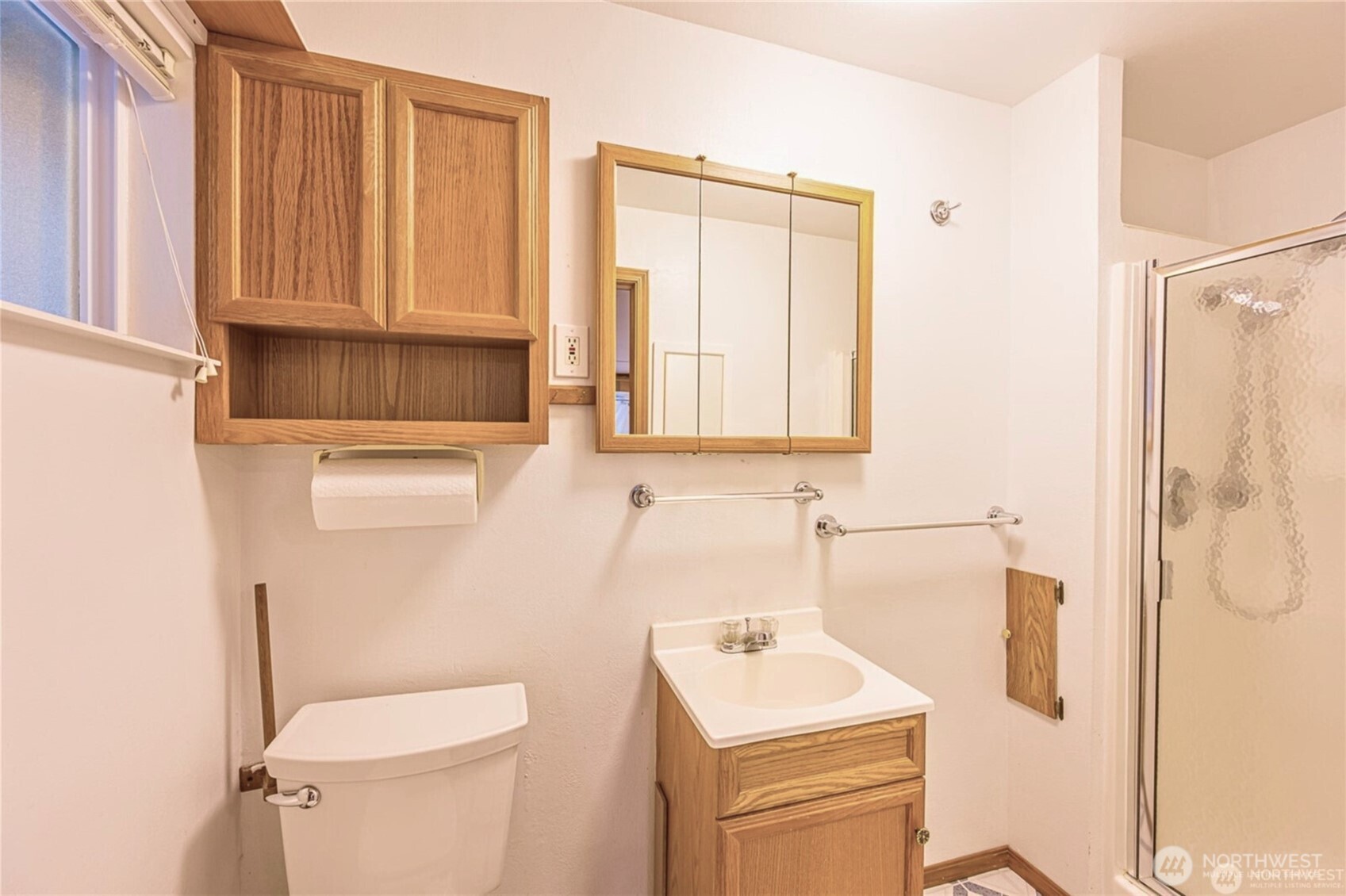 1030 11th Street Port Townsend, WA 98368 - Photo 15 of 21 a bathroom with a sink a toilet and a mirror