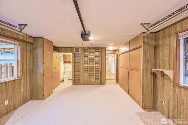 a bedroom with a bed and a table