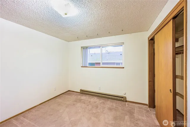 an empty room with a empty space and a window